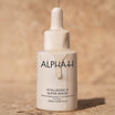 Alpha-H Hyaluronic 8 Super Serum flacone su pietra arenaria
