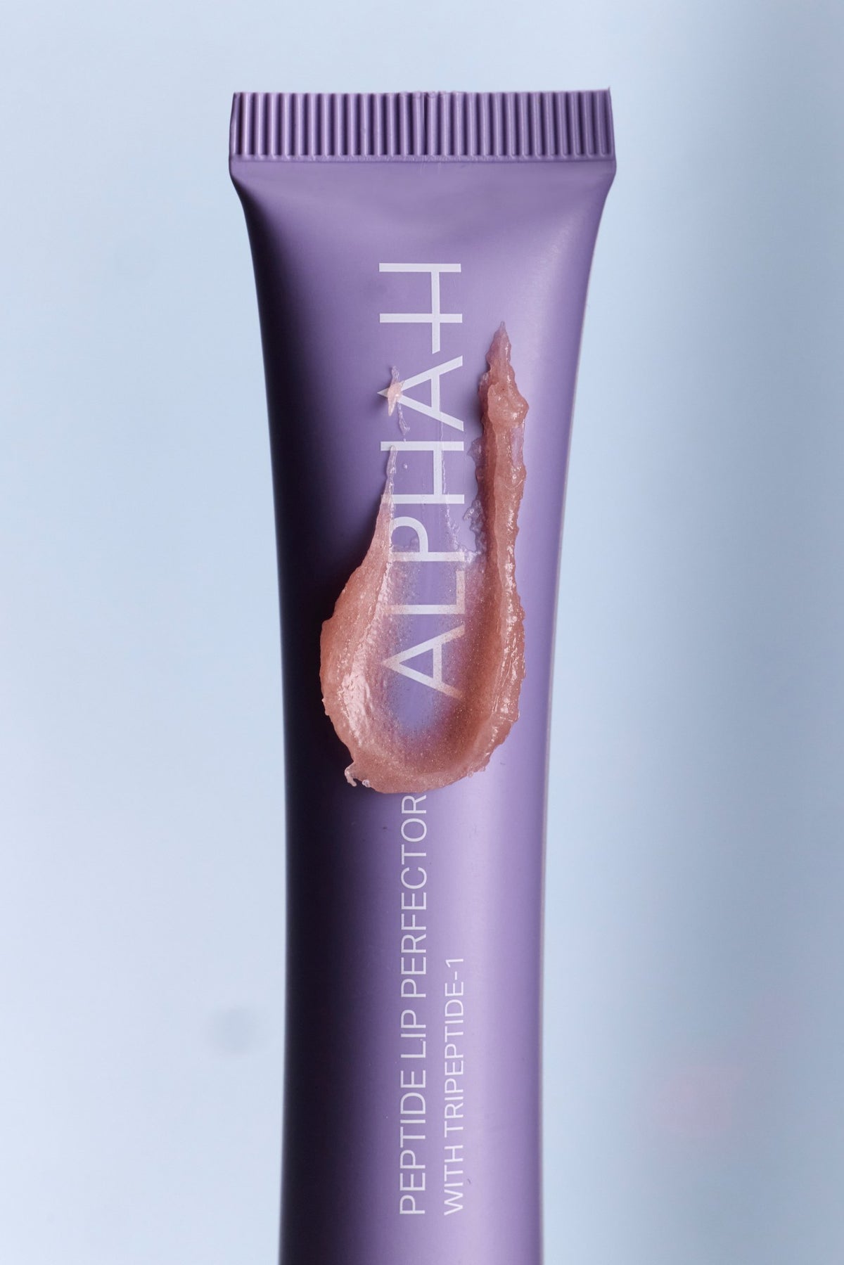 Alpha-H Peptide Lip Perfector tubo con texture