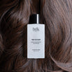 BDK Parfums Hair Perfume Pas Ce Soir flacone su capelli castano scuro