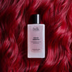 BDK Parfums Hair Perfume Rouge Smoking flacone su capelli rossi