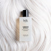 BDK Parfums Hair Perfume Tubereuse Imperiale flacone su capelli biondo platino