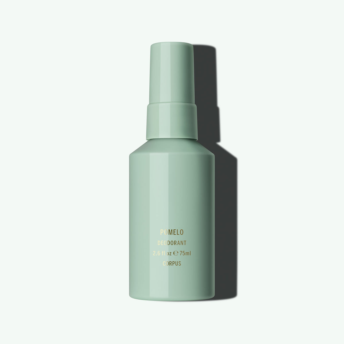 Corpus Naturals Deodorant Spray Pomelo flacone su verde menta