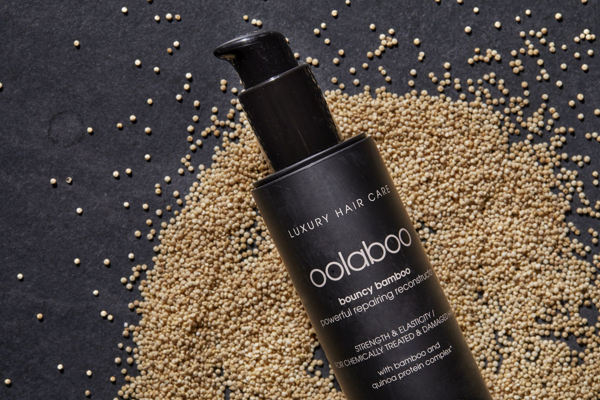 Oolaboo Bouncy Bamboo Repair Shampoo su un letto di semi