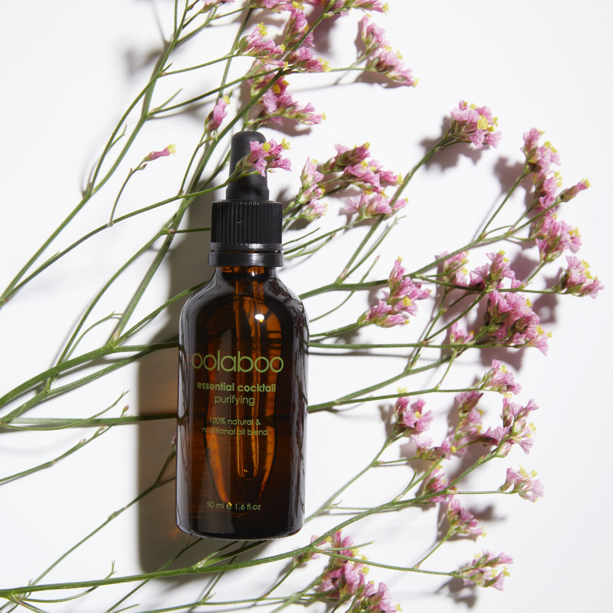 Oolaboo Essential Cocktail Purifying tra fiorellini rosa
