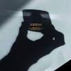 Oolaboo Saveguard Protective Shield SPF30 con l'ombra di una mano